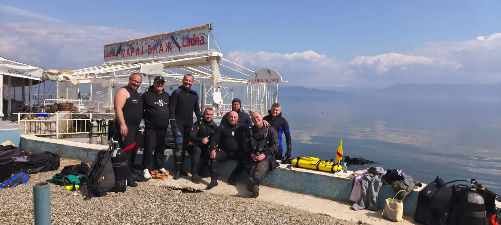 The Amphibia team with scuba diving equipment, Lake Ohrid in the background