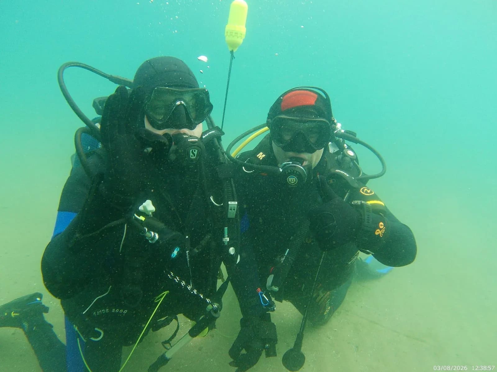Underwater photo of two Amphibia scuba divers during the cleanup action in Lake Ohrid