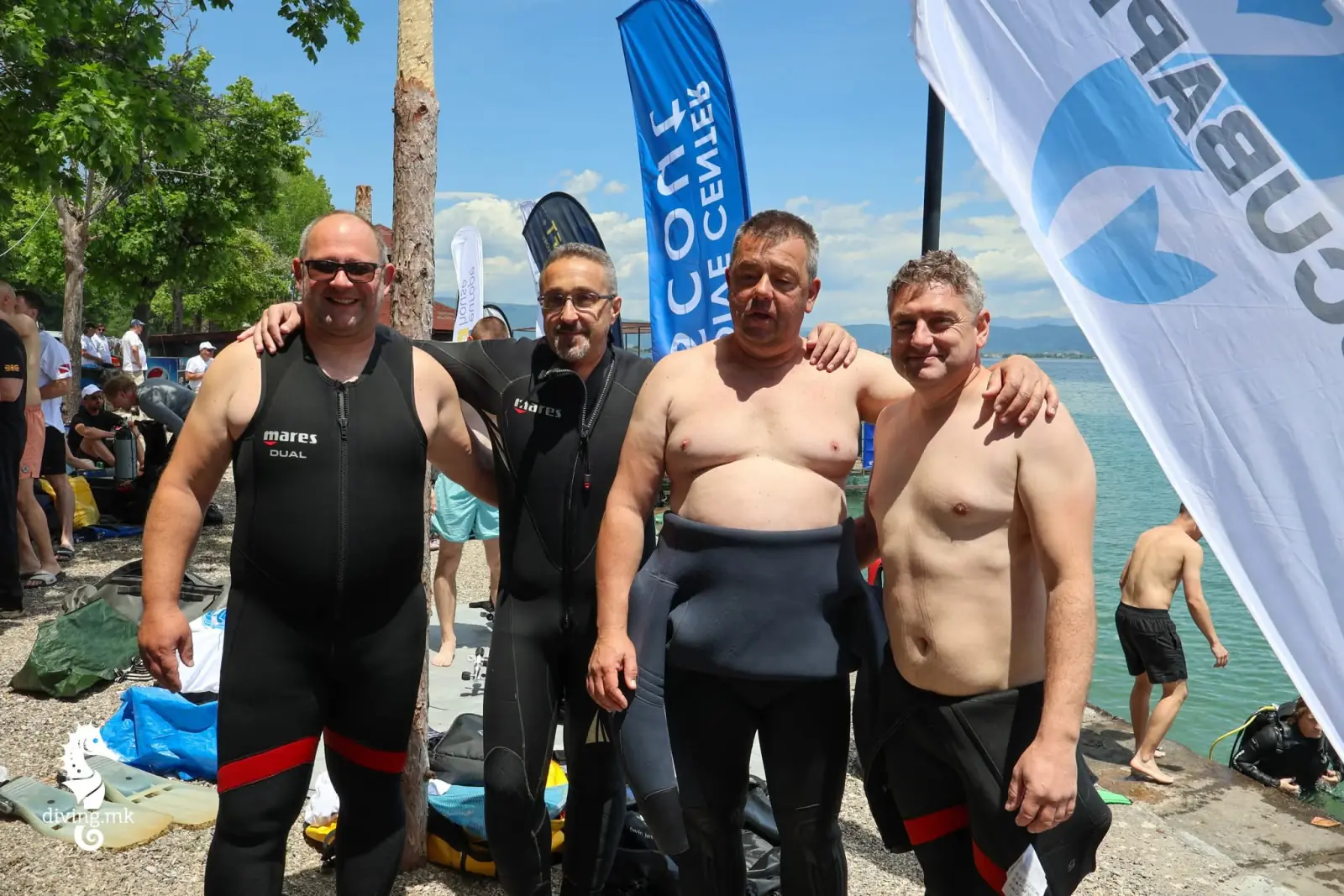 Amphibia team members in wetsuits before a Lake Ohrid scuba dive