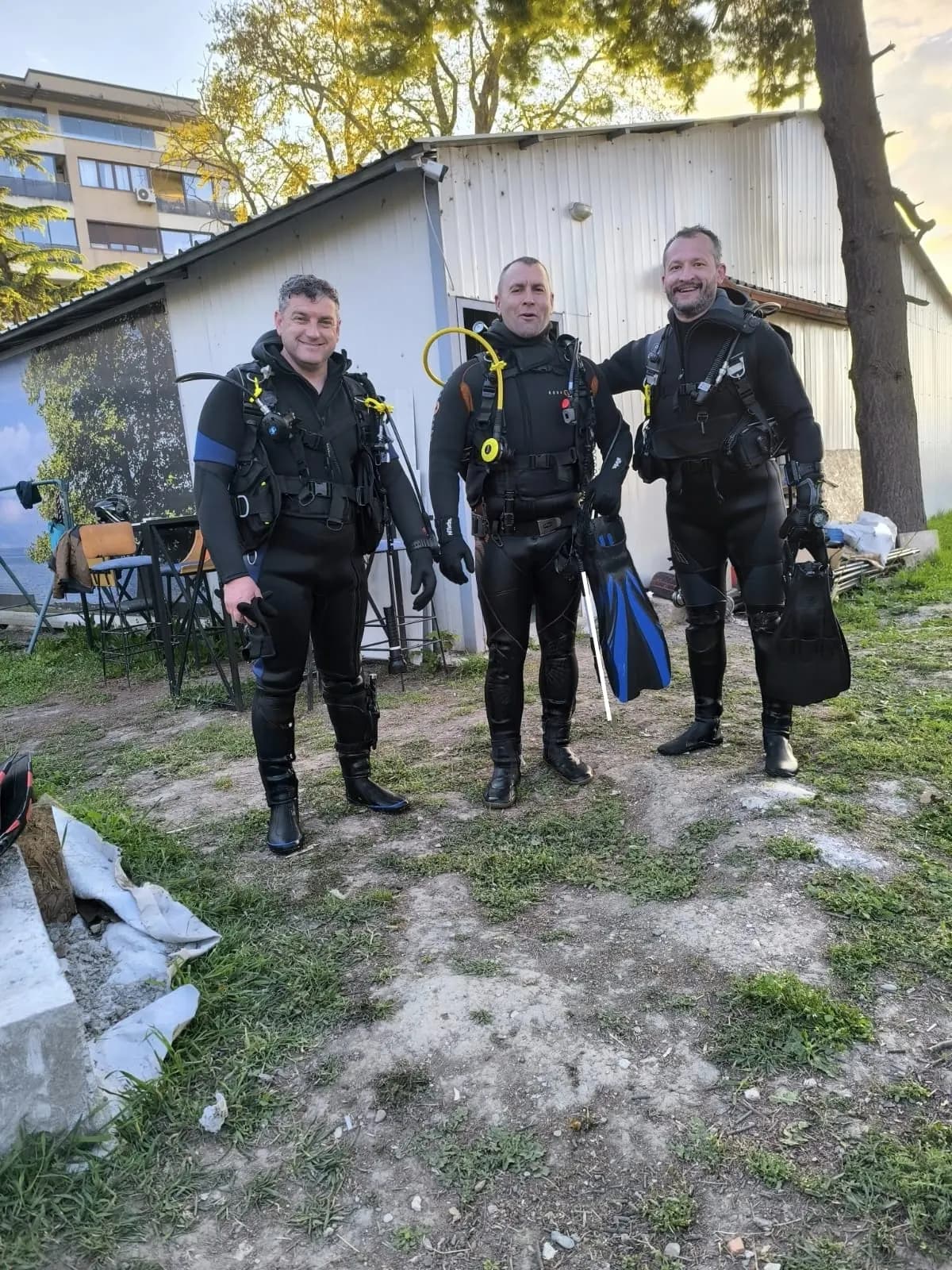 Three Amphibia divers in wetsuits after a dive at Ljubaništa beach