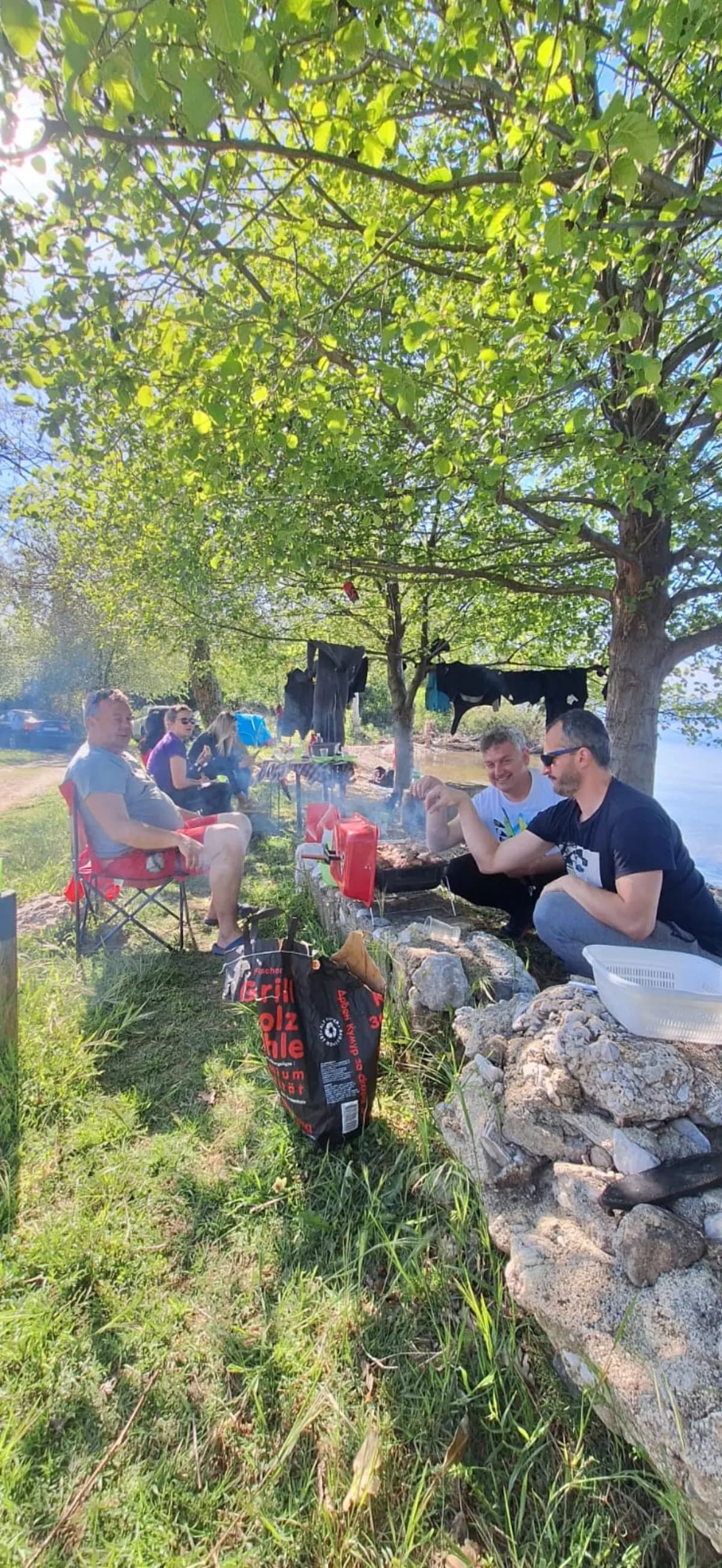 The Amphibia team relaxing under a tree by Lake Ohrid on a May Day outing